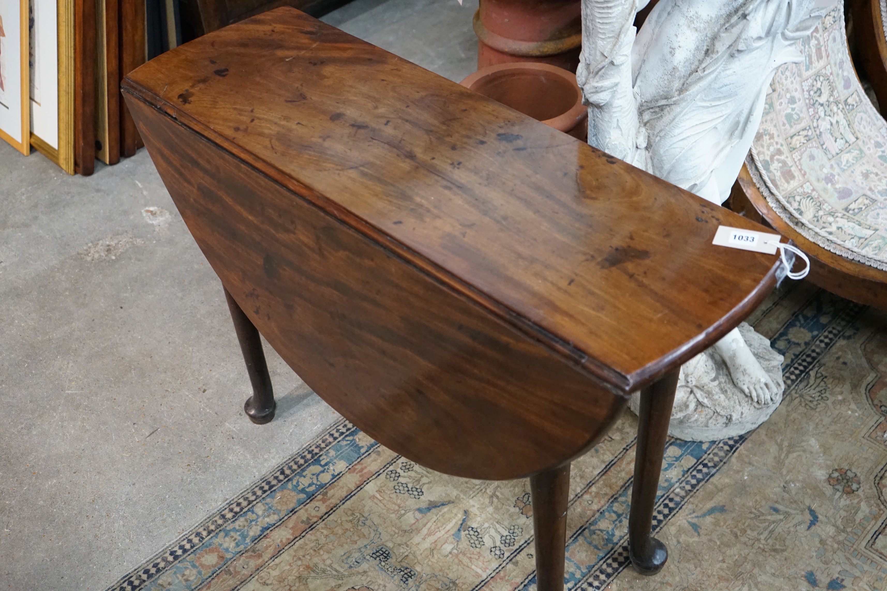 A George III mahogany padfoot drop leaf dining table, length 108cm extended, width 99cm, height 71cm